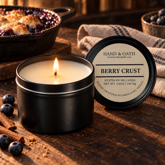 Berry Crust soy candle in a black tin, styled in a home setting