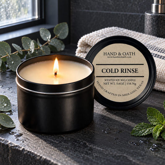Cold Rinse soy candle in a black tin, styled in a home setting