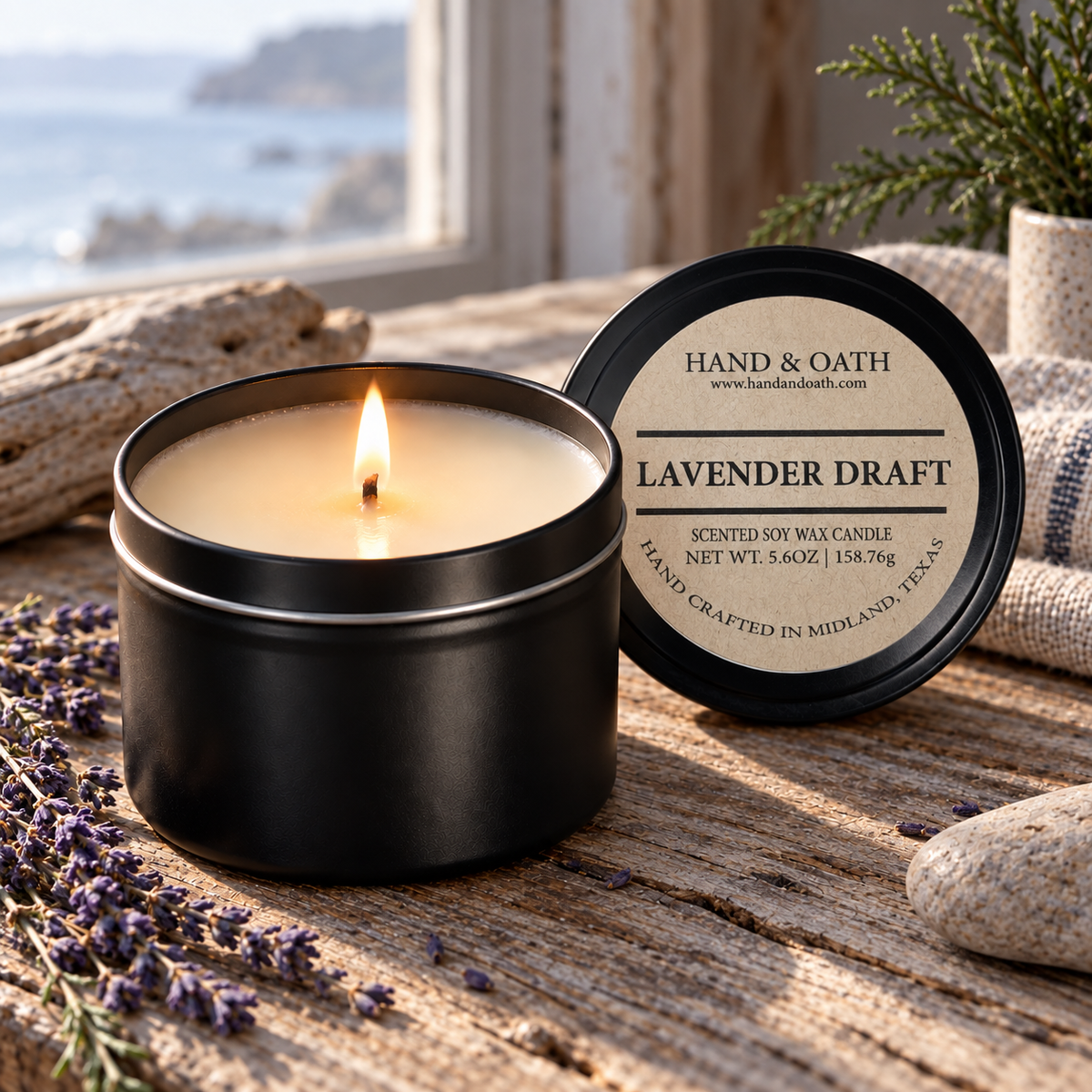 Lavender Draft soy candle in a black tin, styled in a home setting