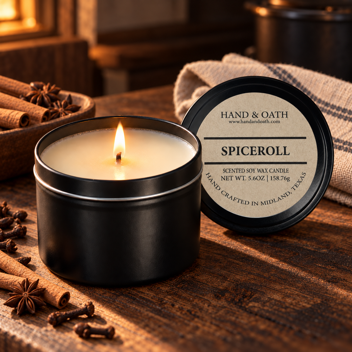 Spiceroll soy candle in a black tin, styled in a home setting